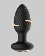 Korek analny INTOYOU Drago - widok z przodu pokazujący spiralną teksturę i kierunek rotacji - czarny