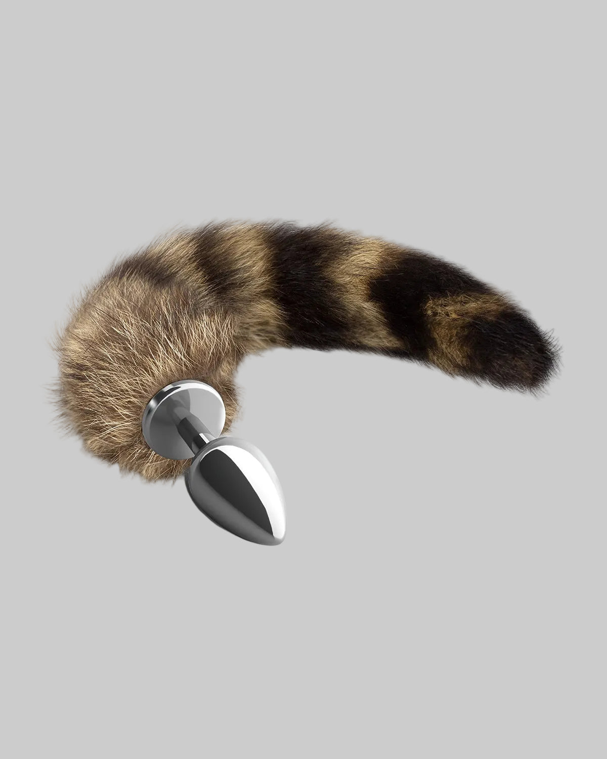 Metalowy korek analny w srebrnym kolorze z długim puszystym ogonem w brązowo-czarne pasy
