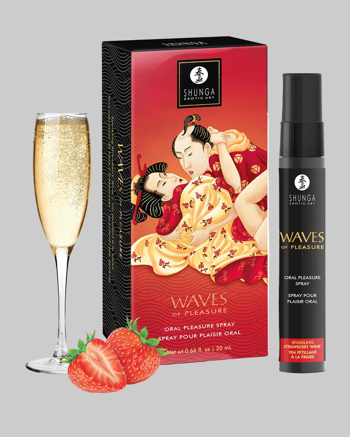 Czerwone pudełko i czarny spray obok kieliszka szampana i świeżych truskawek Shunga Waves of Pleasure