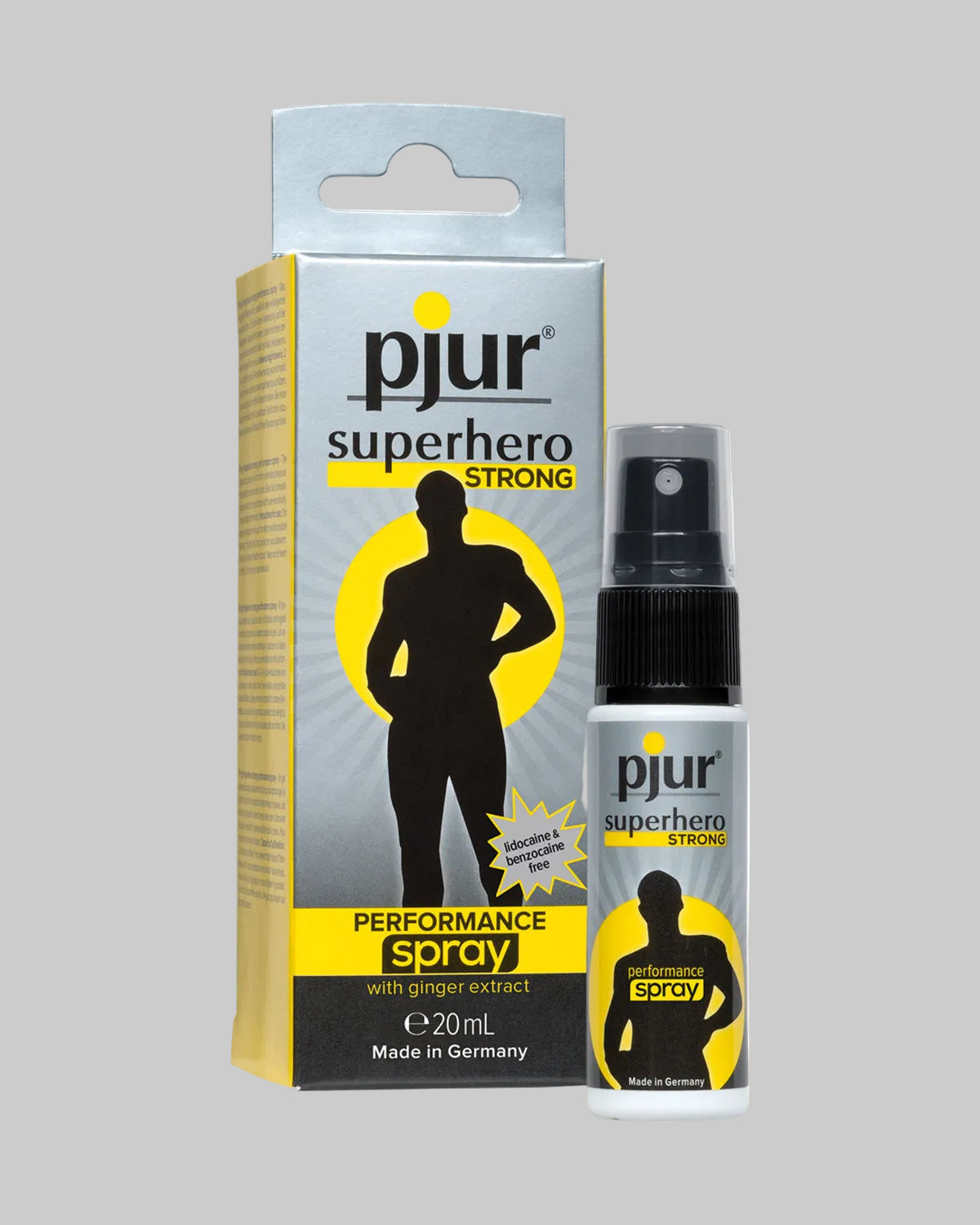 Srebrno-żółte opakowanie sprayu Pjur Superhero Strong 20ml z atomizerem, widok z przodu i butelką