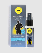 Szary spray Pjur Superhero Ultimate 20ml z czarną pompką, obok niebiesko-szare pudełko z sylwetką mężczyzny.