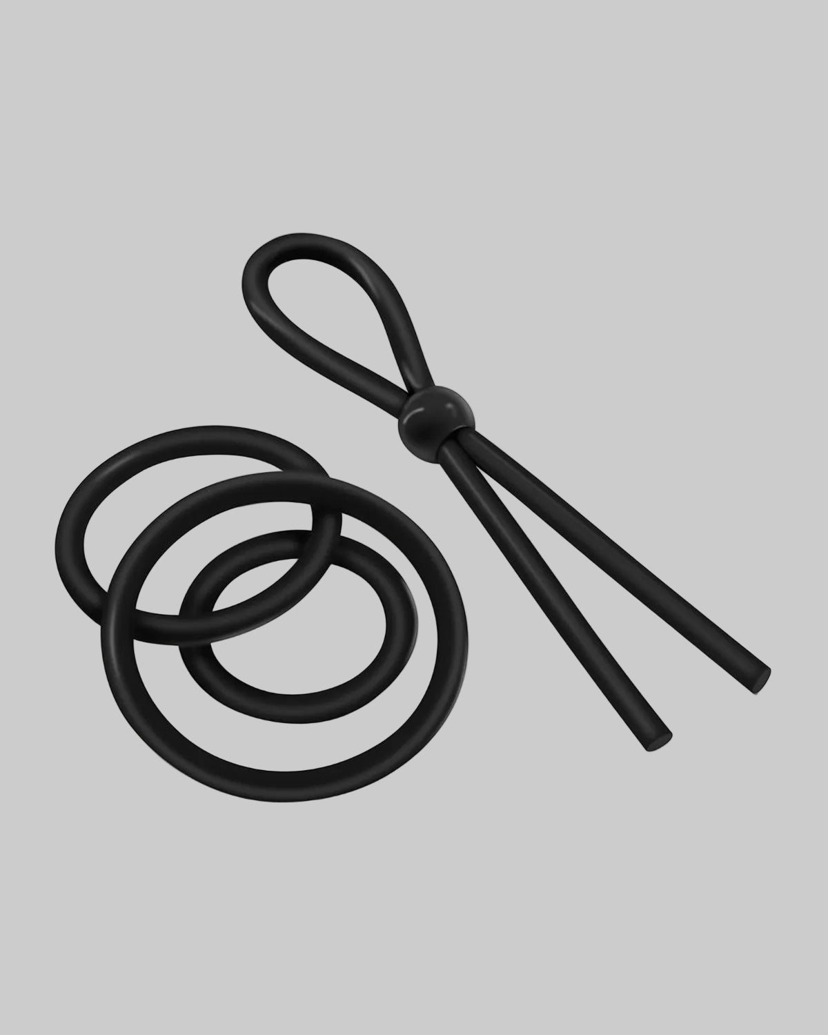 Zestaw czarnych silikonowych pierścieni połączonych z regulowanym sznurkiem z pętlą